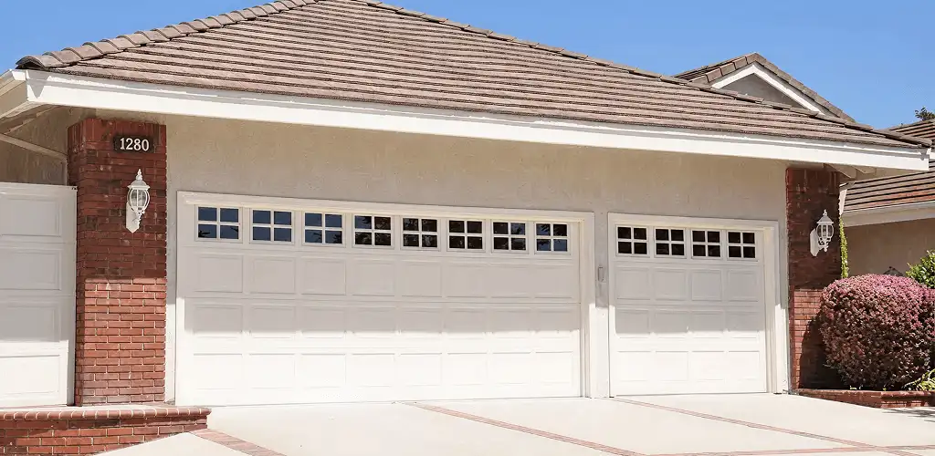 Residential garage door repair service for a double garage door in Sioux Falls, SD